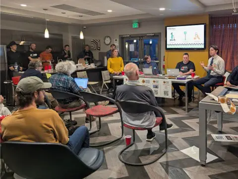 Joel Cox presents his micro-transit idea to local advocates