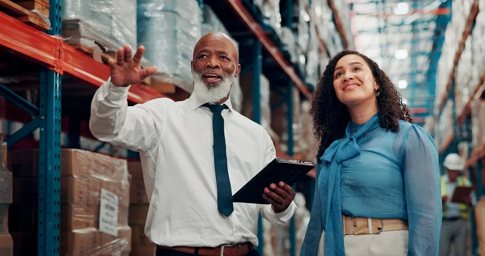 Woman and man talking in warehouse