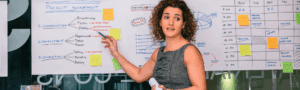 A female project manager outlines the process for completing a project successfully