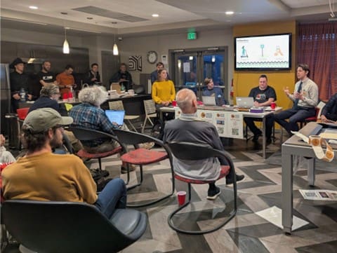 Joel Cox presents his micro-transit idea to local advocates