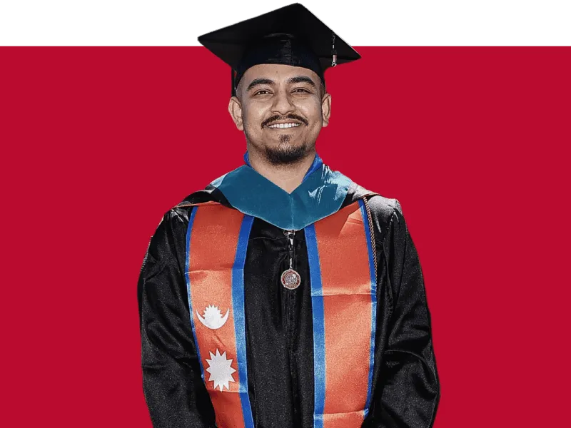 University of Denver professional studies graduate celebrating degree completion